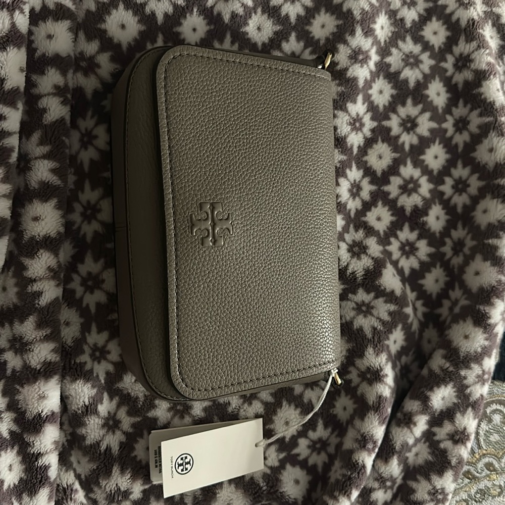 Tory Burch Thea Flap Crossbody 
Style # 144688
Color Gray Heron/082
